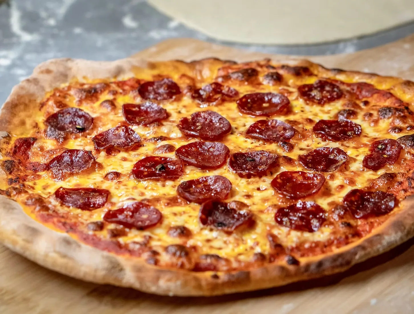 A pepperoni pizza from Pizza by Soho with a blistered crust